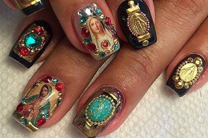  woman's fingernails with icon and jewels 